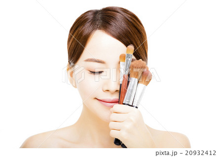 young beautiful woman with Makeup Brush young beautiful woman with Makeup Brush 20932412
