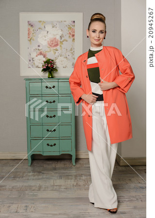 Young girl at the coat in interior 20945267