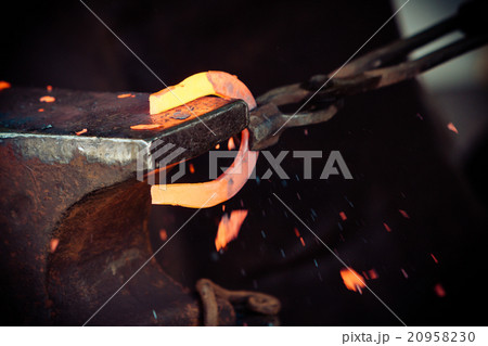 Hammering glowing steel - to strike while the iron is hot. Hammering glowing steel - to strike while the iron is hot. 20958230