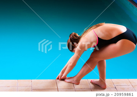 Girl swimmer preparing to jumping and diving Girl swimmer preparing to jumping and diving 20959861