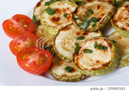 fried zucchini with fresh cherry tomatoes top view 20960561