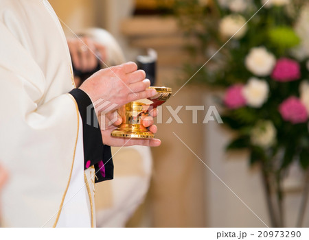 Catholic priest granting the Communion 20973290