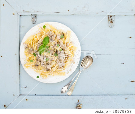 Pasta mafaldine with mushrooms and cream sauce in 20979358