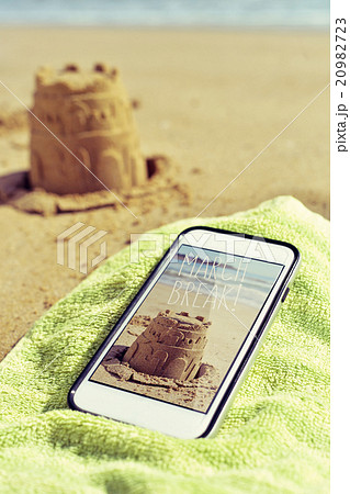 sandcastle and text march break in a smartphone 20982723