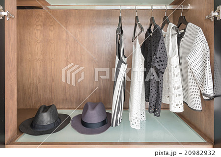 shirts and suite hanging on rail  20982932