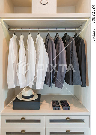 black and white shirts hanging on rail black and white shirts hanging on rail 20982934