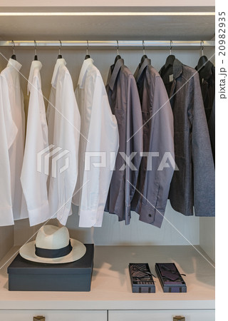 black and white shirts hanging on rail black and white shirts hanging on rail 20982935