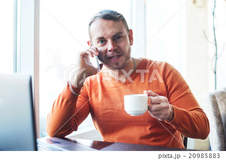 man working with notebook, talking on the phone,  20985883