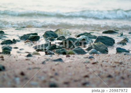 Rock in the sea with surf 20987972