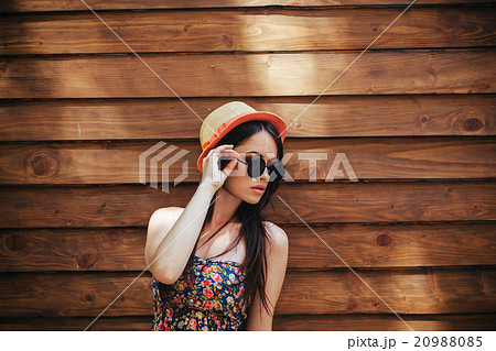 beautiful girl poses for camera in the city 20988085