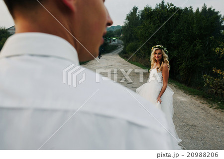 bride leads groom on the road bride leads groom on the road 20988206