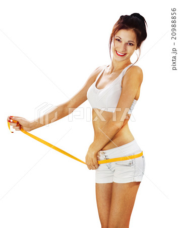 happy woman measures her waist l 20988856