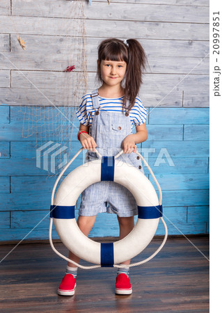 girl holding a life preserver girl holding a life preserver 20997851