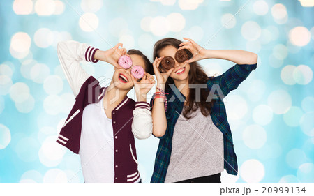 happy pretty teenage girls with donuts having fun happy pretty teenage girls with donuts having fun 20999134