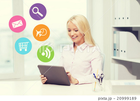 smiling businesswoman or student with tablet pc 20999189