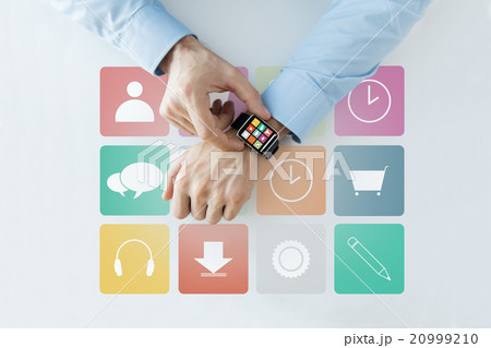 hands with application icons on smart watch hands with application icons on smart watch 20999210