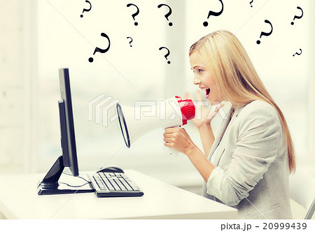 strict businesswoman shouting in megaphone strict businesswoman shouting in megaphone 20999439