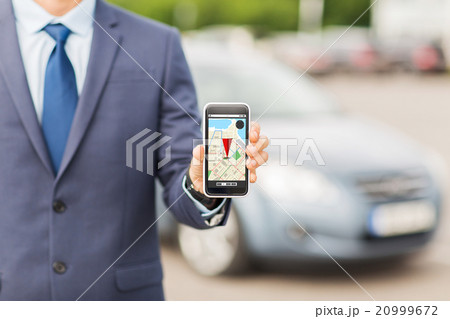 close up of business man with smartphone navigator 20999672
