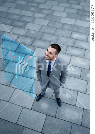 young smiling businessman outdoors from top 21000277