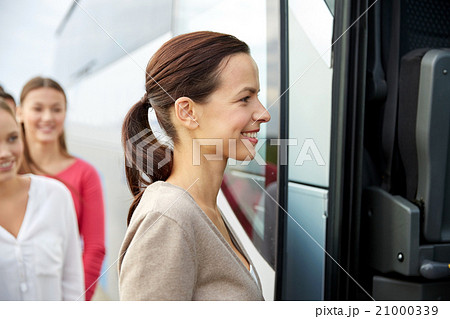 group of happy passengers boarding travel bus group of happy passengers boarding travel bus 21000339