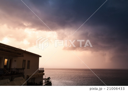 Coastal morning landscape, cloudy sky and house 21006433