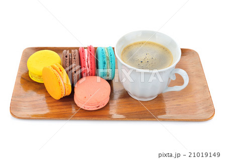 close up of colorful macarons and cup of coffee close up of colorful macarons and cup of coffee 21019149