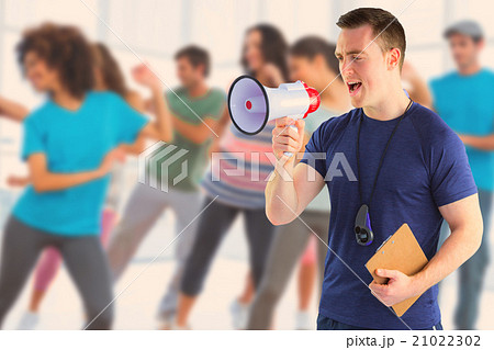 Composite image of male trainer yelling through the megaphone Composite image of male trainer yelling through the megaphone 21022302