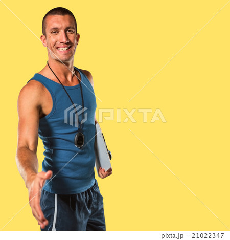Composite image of happy personal trainer giving handshake 21022347