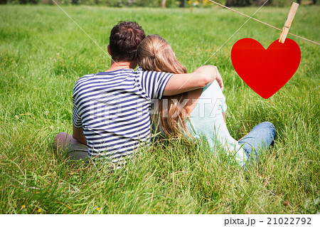 Composite image of cute couple in the park 21022792