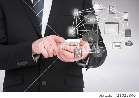 Composite image of businessman sending a text message 21022840