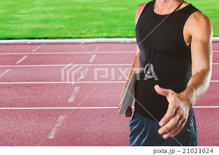 Composite image of personal trainer giving handshake Composite image of personal trainer giving handshake 21023024