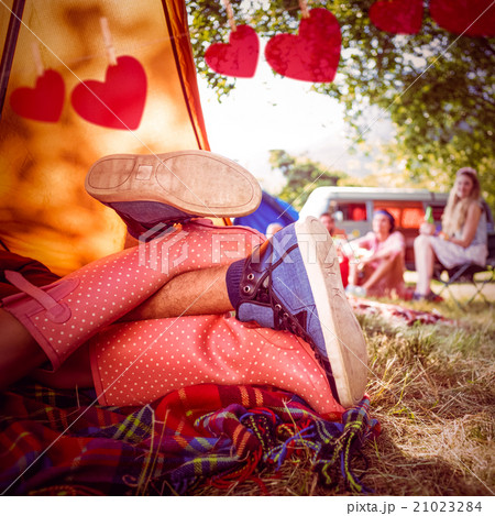 Composite image of young couple making out in tent Composite image of young couple making out in tent 21023284