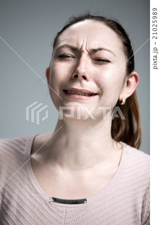 The crying woman with tears on face closeup 21025989