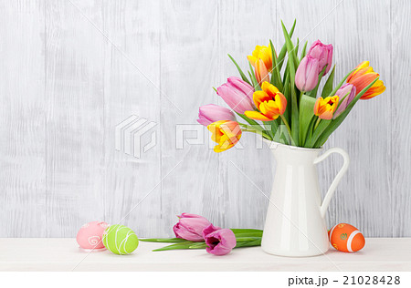 Easter eggs and colorful tulips bouquet 21028428