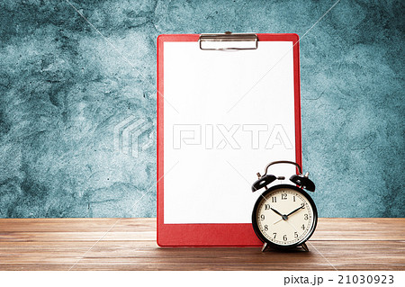 Blank paper sheet and alarm clock Blank paper sheet and alarm clock 21030923