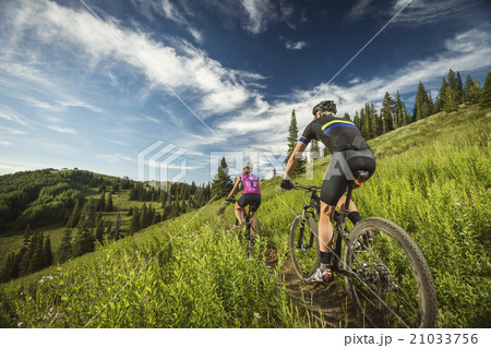 Mature couple during bicycle trip in mountain scenery 21033756