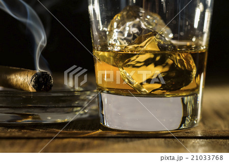 Whiskey and cigar on table Whiskey and cigar on table 21033768