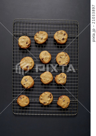 Baked chocolate cookies on cooling rack Baked chocolate cookies on cooling rack 21033897