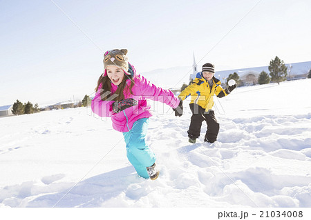 Children (8-9, 10-11) playing in snow Children (8-9, 10-11) playing in snow 21034008