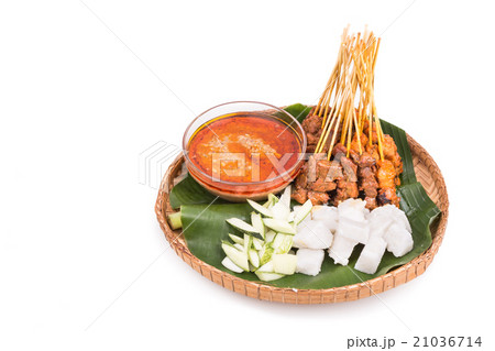 Barbecue satay served on traditional rattan plate Barbecue satay served on traditional rattan plate 21036714