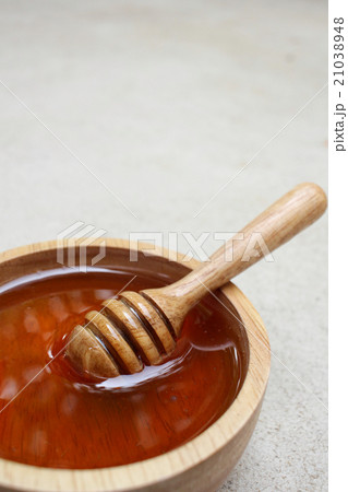 Fresh honey with honey dipper Fresh honey with honey dipper 21038948