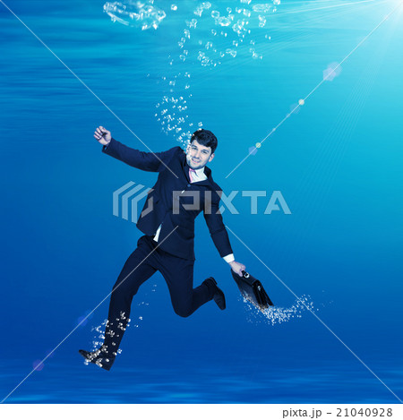Businessman sinking in water Businessman sinking in water 21040928