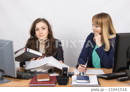 one employee inundated with work and looking at the frame, the other does nothing, and with one employee inundated with work and looking at the frame, the other does nothing, and with 21041518