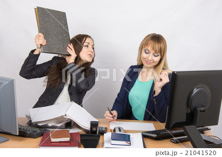 The girl in the office threatens to hit another folder employee The girl in the office threatens to hit another folder employee 21041520