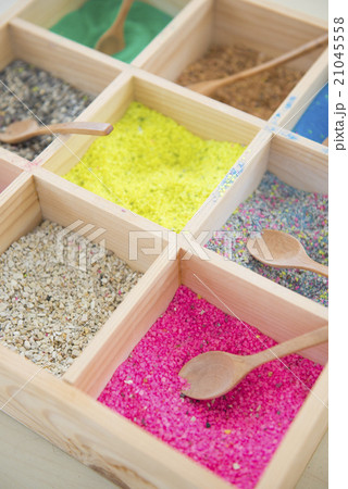colorful sands and colorful rocks in wooden box colorful sands and colorful rocks in wooden box 21045558