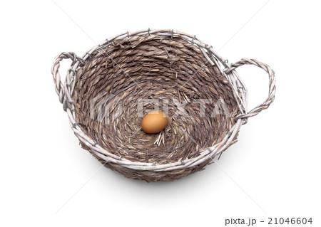 egg lies in a large basket on a white background 21046604
