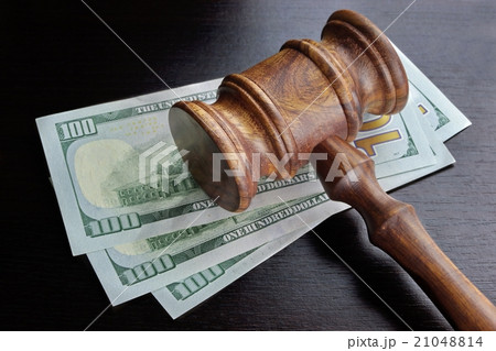 Judges Gavel And Dollar Cash  On The Black Table 21048814