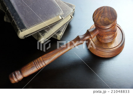 Judges Gavel And Old Book  On The Wooden Table 21048833