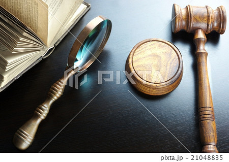 Judges Gavel, Magnifier And Old Book On The Table 21048835
