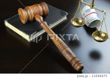Judges Gavel, Scale, Old Book And Cash On Table Judges Gavel, Scale, Old Book And Cash On Table 21048875
